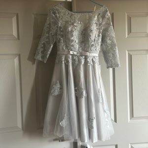 Lace dress with sleeves and corset back